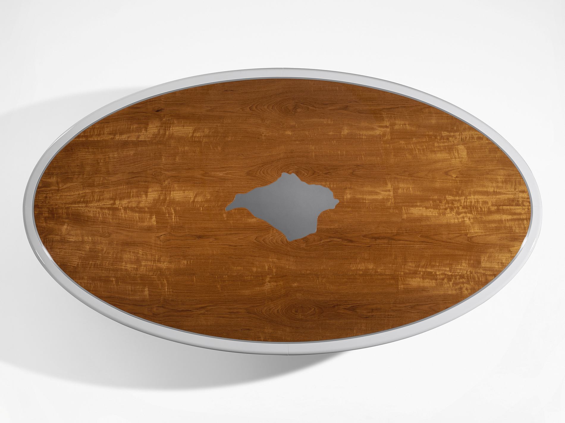 Bespoke oval table with inlaid detail, overhead view