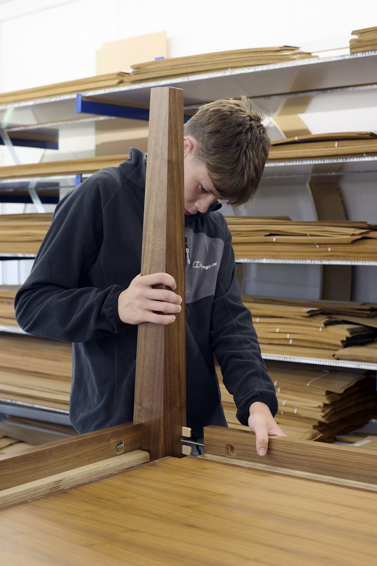 Apprentice assembling a table leg joint